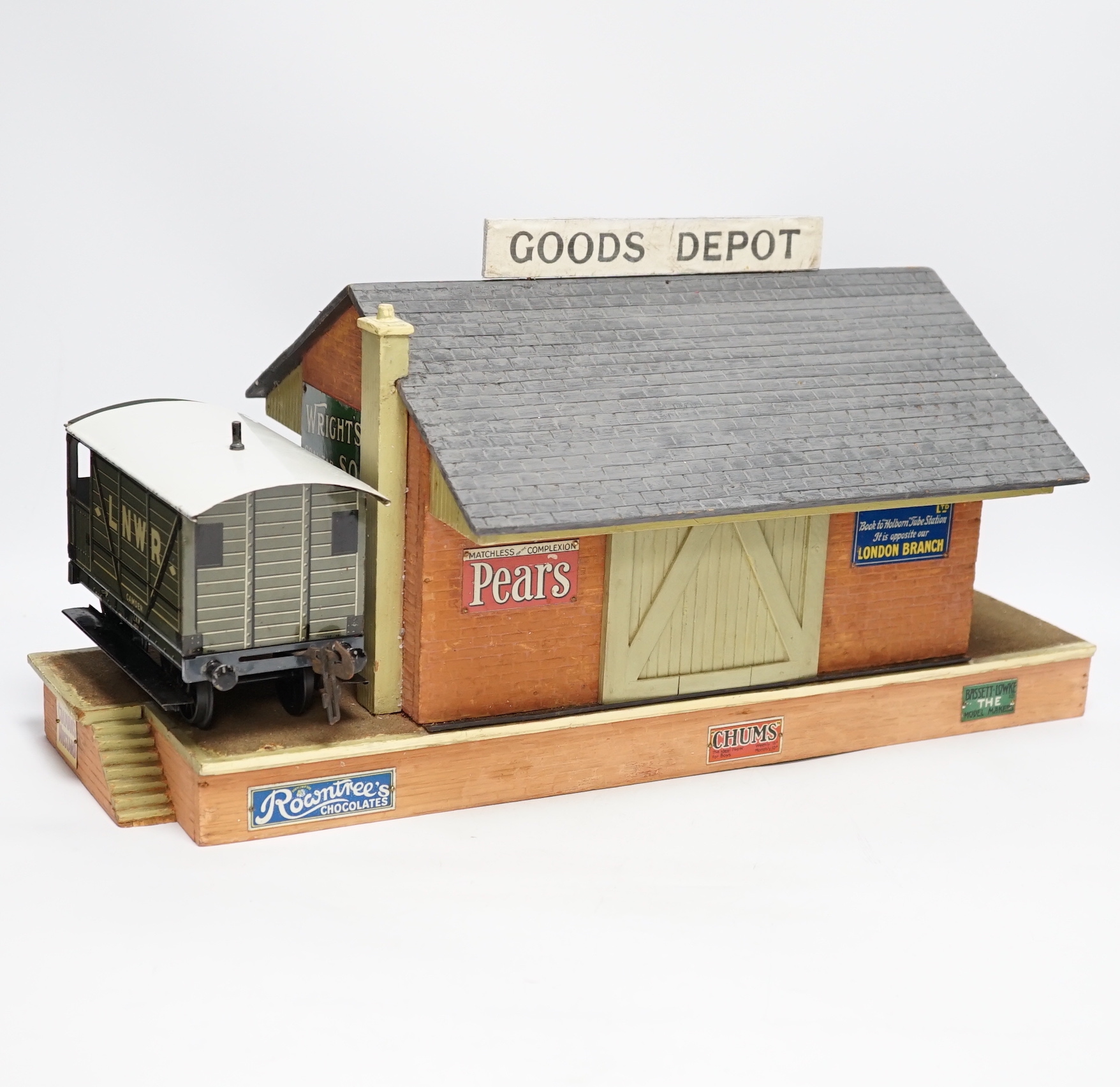 Eight items of Gauge One and 0 gauge model railway including; a Bassett-Lowke guard’s van, a cattle wagon, a gantry signal footbridge, and two further Hornby signals, a well detailed scratch built Signal Box, a scratch b